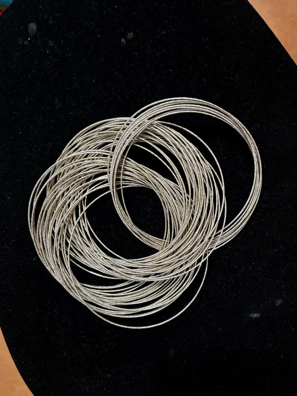Bracelet sterling silver plated memory wire loops. 59 bangles. Excellent